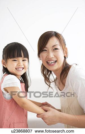 Mother and daughter holding hands View Large Photo Image Stock Photo - Mother and daughter holding hands. Fotosearch