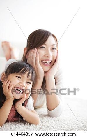 Mother and daughter with hands on chins View Large Photo Image Stock Photo - Mother and daughter with hands on chins. Fotosearch