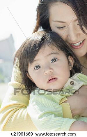 Mother Hugging Baby Daughter View Large Photo Image Stock Photo - Mother Hugging Baby Daughter. Fotosearch