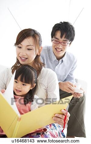 Mother reading a book with daughter View Large Photo Image Stock Image - Mother reading a book with daughter. Fotosearch