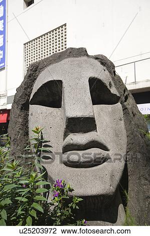Stock Image - Moyai Statue at Shibuya Station. Fotosearch