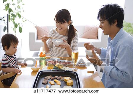 Parents and Baby Boy Having Dinner View Large Photo Image Stock Photo - Parents and Baby Boy Having Dinner. Fotosearch