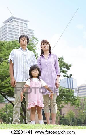 Parents and Daughter (4-5) Standing in Park View Large Photo Image Stock Image - Parents and Daughter (4-5) Standing in Park. Fotosearch