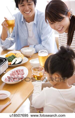 Parents and Daughter Having Dinner View Large Photo Image Stock Photography - Parents and Daughter Having Dinner. Fotosearch