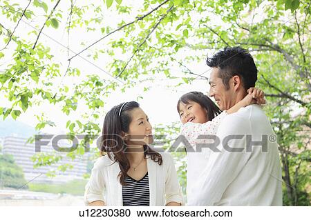 Parents and Daughter in Park View Large Photo Image Stock Image - Parents and Daughter in Park. Fotosearch