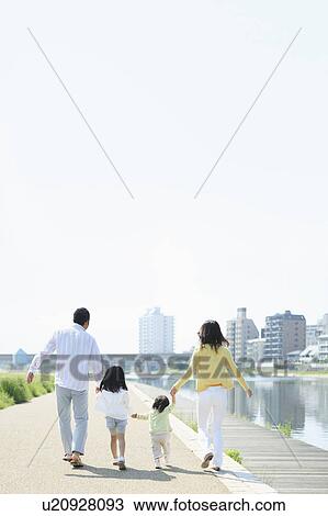 Parents and Two Daughters Walking at Waterfront View Large Photo Image Stock Image - Parents and Two Daughters Walking at Waterfront. Fotosearch