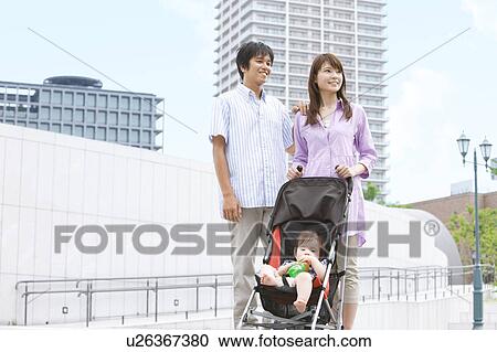 Parents with Baby Boy in Buggy View Large Photo Image Stock Image - Parents with Baby Boy in Buggy. Fotosearch