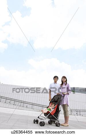 Parents with Baby Boy in Buggy View Large Photo Image Stock Photography - Parents with Baby Boy in Buggy. Fotosearch