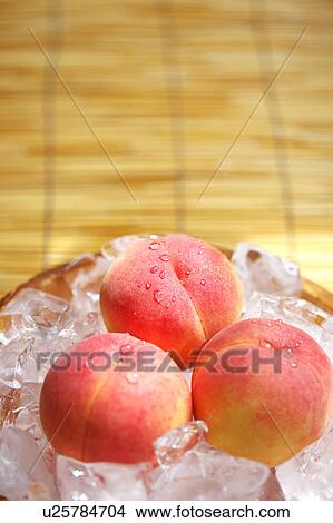 Peaches in Ice Bucket View Large Photo Image Picture - Peaches in Ice Bucket. Fotosearch