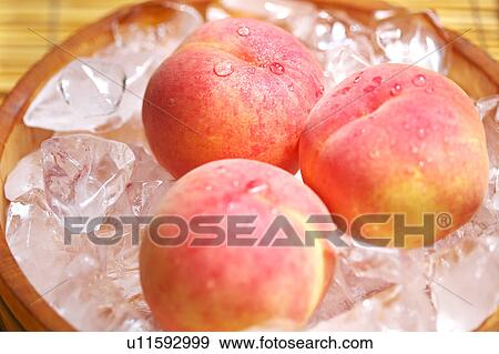 Peaches in Ice Bucket View Large Photo Image Stock Photo - Peaches in Ice Bucket. Fotosearch