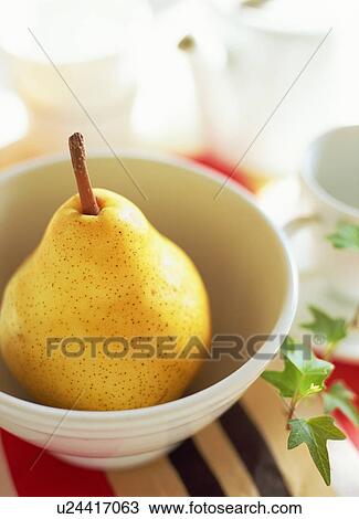 Stock Image - Pear in a bowl. Fotosearch