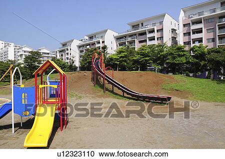 Stock Image - Playground and Apartment Buildings. Fotosearch