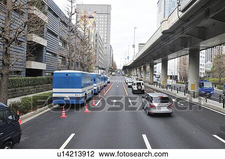 Stock Image - Police vans near National Diet Building, Tokyo Prefecture, Japan. Fotosearch
