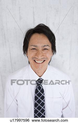 Portrait of mature businessman smiling View Large Photo Image Stock Photograph - Portrait of mature businessman smiling. Fotosearch