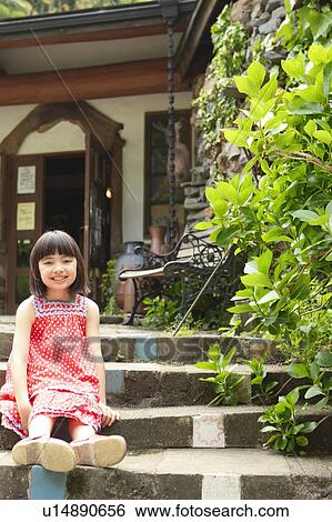 Stock Photograph - Portrait of Young Girl Sitting on Steps. Fotosearch