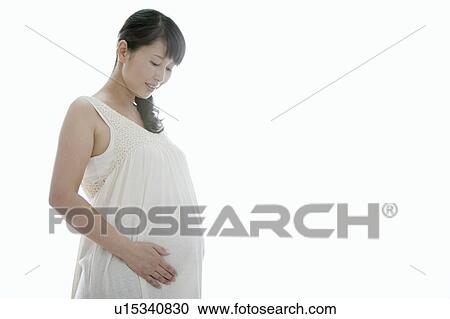 Stock Image - Pregnant Mid Adult Woman. Fotosearch