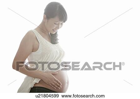 Stock Photo - Pregnant Mid Adult Woman. Fotosearch