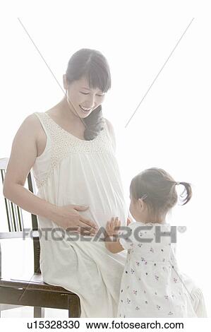 Pregnant Mother and Her Young Daughter View Large Photo Image Stock Image - Pregnant Mother and Her Young Daughter. Fotosearch