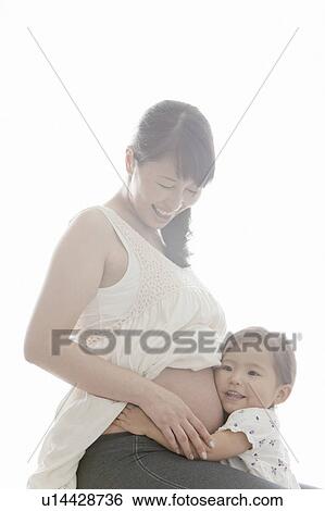 Pregnant Mother and Her Young Daughter View Large Photo Image Stock Photograph - Pregnant Mother and Her Young Daughter. Fotosearch