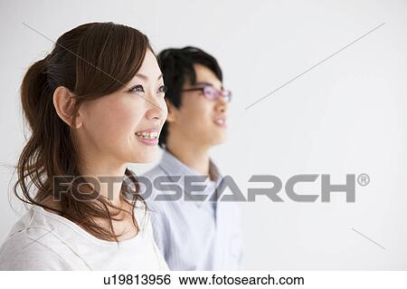 Profile of young couple View Large Photo Image Stock Photograph - Profile of young couple. Fotosearch