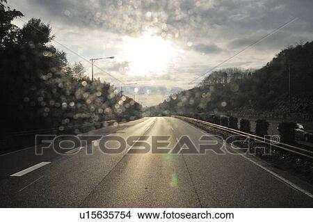 Picture - Raindrop on car window, Kanagawa Prefecture, Japan. Fotosearch