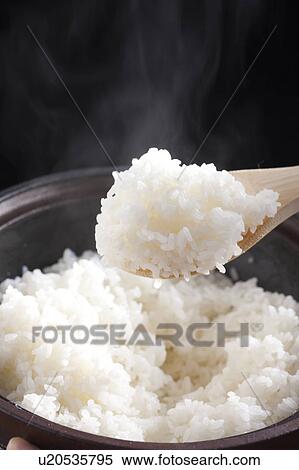 Rice and a paddle View Large Photo Image Stock Photography - Rice and a paddle. Fotosearch