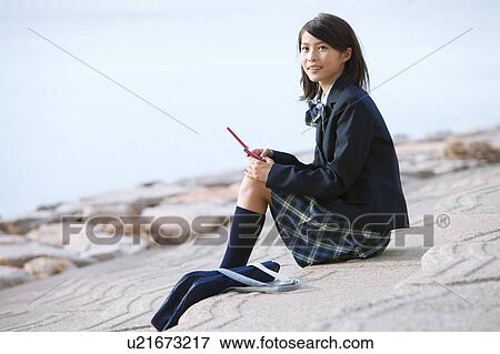School Girl Using Mobile Phone at Beach View Large Photo Image Stock Photo - School Girl Using Mobile Phone at Beach. Fotosearch