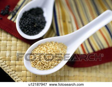 Sesame seeds in spoons View Large Photo Image Stock Photo - Sesame seeds in spoons. Fotosearch