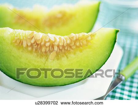 Stock Image - Slices of melon. Fotosearch
