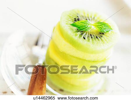 Stack of sliced kiwi fruits View Large Photo Image Stock Photography - Stack of sliced kiwi fruits. Fotosearch