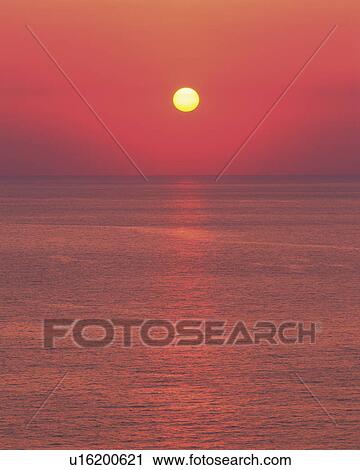 Sun Setting Over Sea View Large Photo Image Stock Image - Sun Setting Over Sea. Fotosearch
