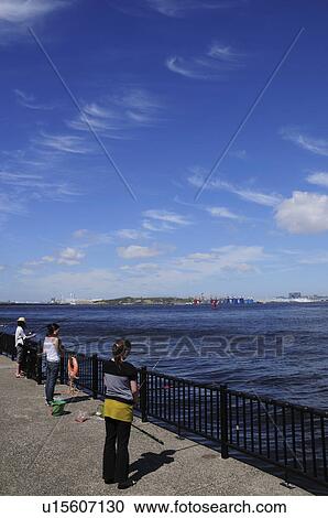 Stock Image - Three Women Fishing at Wakasu Kaihin Park. Fotosearch