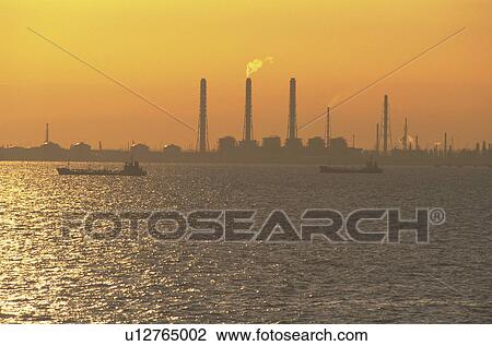 Stock Image - Tokyo Bay and Factories at Dawn. Fotosearch