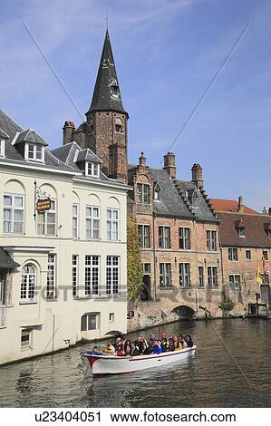 Stock Image - Tourboat in Canal. Fotosearch