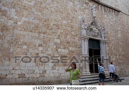 Tourists at the Entrance of Franciscan Monastery View Large Photo Image Stock Photo - Tourists at the Entrance of Franciscan Monastery. Fotosearch