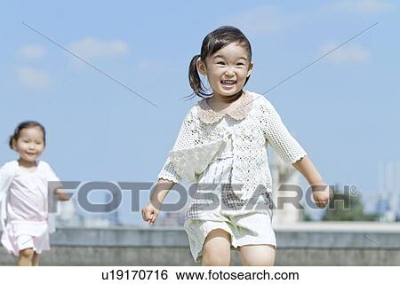 Two Girls Running View Large Photo Image Stock Photograph - Two Girls Running. Fotosearch