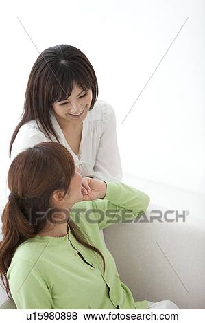 Two Mid Adult Female Friends Talking View Large Photo Image Stock Photo - Two Mid Adult Female Friends Talking. Fotosearch