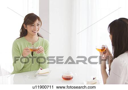 Two Mid Adult Women Having Tea and Cake View Large Photo Image Stock Image - Two Mid Adult Women Having Tea and Cake. Fotosearch