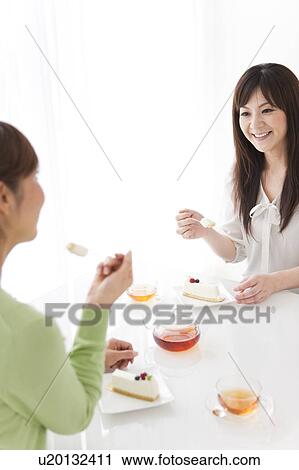 Two Mid Adult Women Having Tea and Cake View Large Photo Image Stock Image - Two Mid Adult Women Having Tea and Cake. Fotosearch