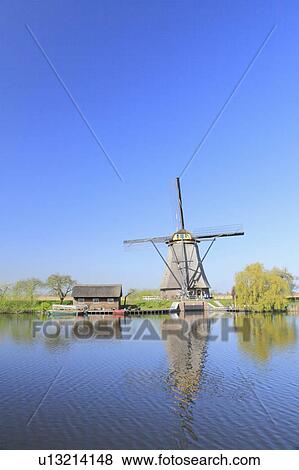 Stock Photo - Windmill by River. Fotosearch