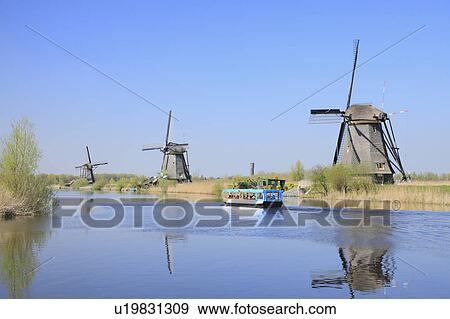 Stock Photo - Windmills at Riverside. Fotosearch