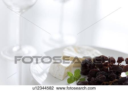 Wineglasses and Cheese with Raisings View Large Photo Image Stock Image - Wineglasses and Cheese with Raisings. Fotosearch