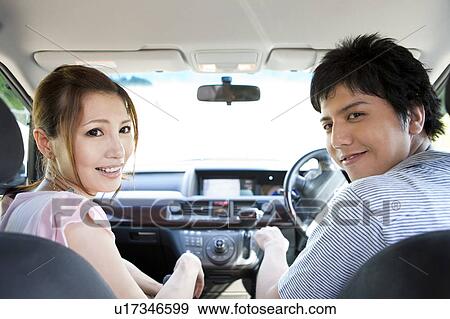 Stock Photo - Young Couple in Car. Fotosearch