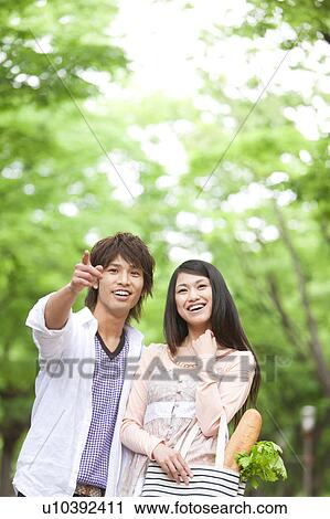 Young couple looking View Large Photo Image Stock Image - Young couple looking. Fotosearch