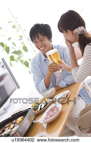 Young Couple Toasting With Beer View Large Photo Image Stock Image - Young Couple Toasting With Beer. Fotosearch