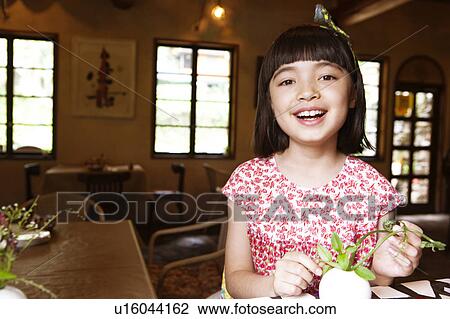 Young Girl Arranging Flowers in Vase View Large Photo Image Stock Image - Young Girl Arranging Flowers in Vase. Fotosearch