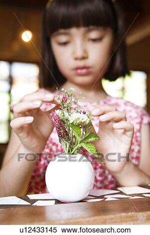 Young Girl Arranging Flowers in Vase View Large Photo Image Stock Photography - Young Girl Arranging Flowers in Vase. Fotosearch