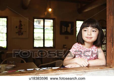 Stock Photograph - Young Girl at Window. Fotosearch