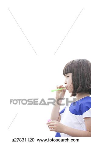Young Girl Blowing Into Bubble Wand View Large Photo Image Stock Image - Young Girl Blowing Into Bubble Wand. Fotosearch