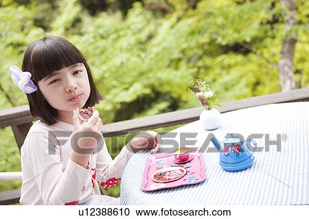 Young Girl Eating Biscuit View Large Photo Image Stock Image - Young Girl Eating Biscuit. Fotosearch